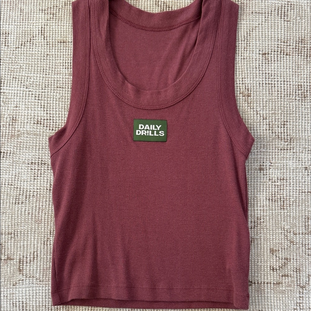 Daily Drills
LOGO RIBBED TANK
XS/S
Wine